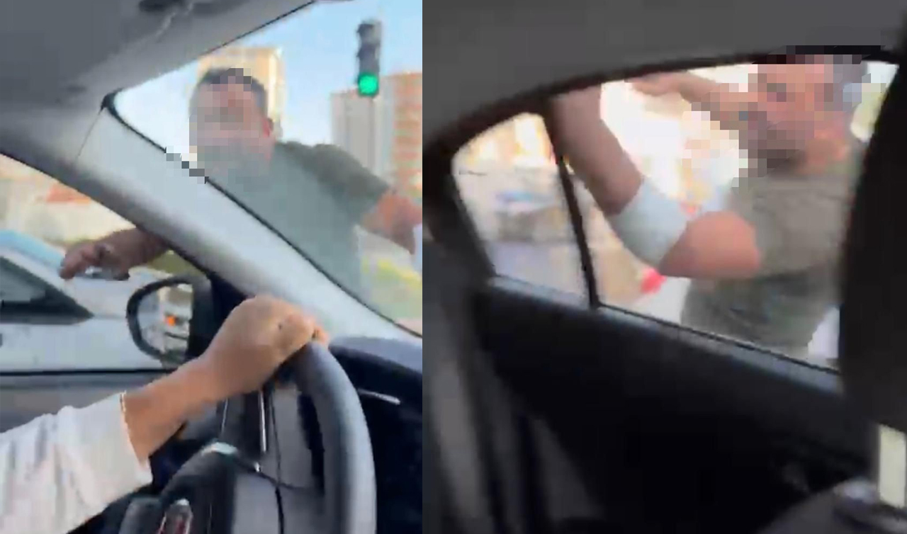 Trafikte tartıştığı kadınların otomobilini yumrukladı